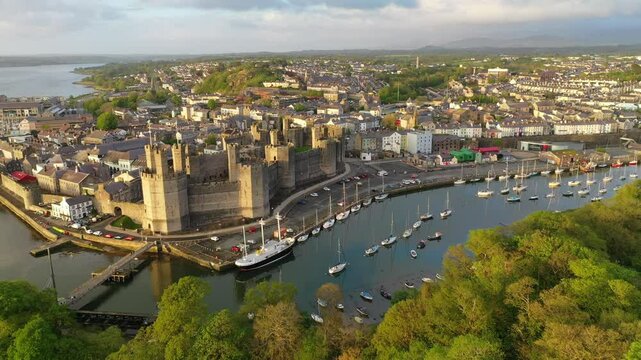 Aerial clip of Caernarfon Castle, UNESCO World Heritage Site, Gwynedd, North Wales, United Kingdom, Europe