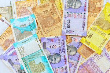 Indian rupees in various denominations as well as banknotes with business economic investment