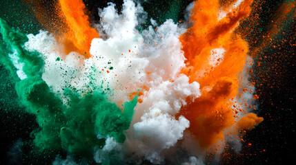 A bright explosion of green, white and orange holi colors on a black background. The concept of the flag of Ireland from an explosion of powdered paints. Abstract background