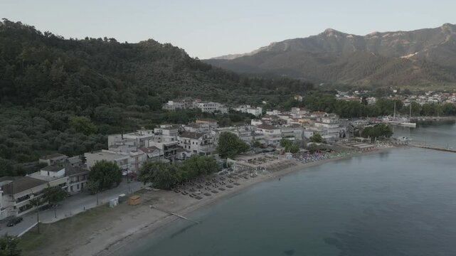Drone view of Aegean Sea and Thasos Town at sunrise, Thassos Town (Limenas), Thassos, Aegean Sea, Greek Islands, Greece, Europe