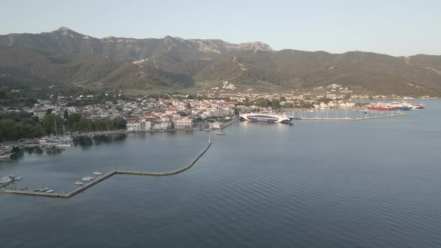 Drone view of Aegean Sea and Thasos Town at sunrise, Thassos Town (Limenas), Thassos, Aegean Sea, Greek Islands, Greece, Europe