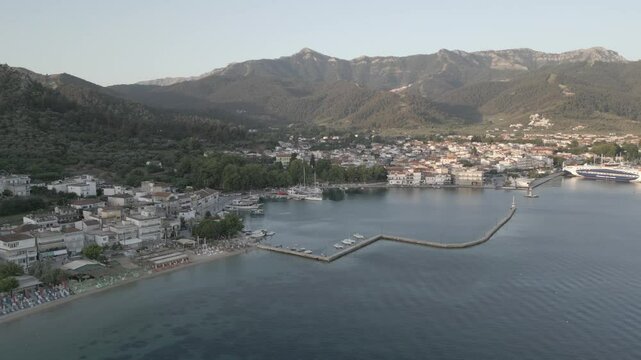 Drone view of Aegean Sea and Thasos Town at sunrise, Thassos Town (Limenas), Thassos, Aegean Sea, Greek Islands, Greece, Europe