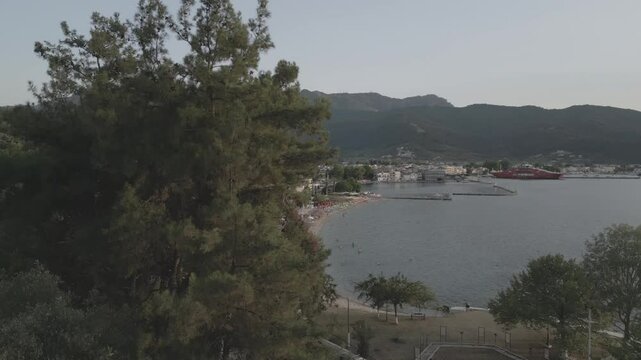 Drone view of Thassos Town (Limenas) and Aegean Sea at sunset, Thassos Town (Limenas), Thassos, Aegean Sea, Greek Islands, Greece, Europe