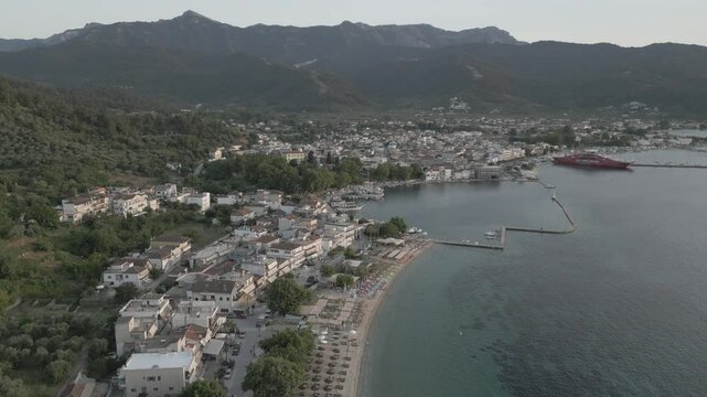 Drone view of Thassos Town (Limenas) and Aegean Sea at sunset, Thassos Town (Limenas), Thassos, Aegean Sea, Greek Islands, Greece, Europe
