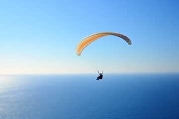 Someone paragliding over the Pacific Ocean in SoCal