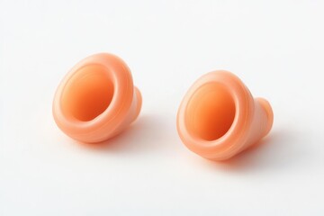 White background with ear plugs made of silicone for humans