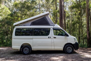 White campervan parked in Girraween National Park Australia viewed from the side
