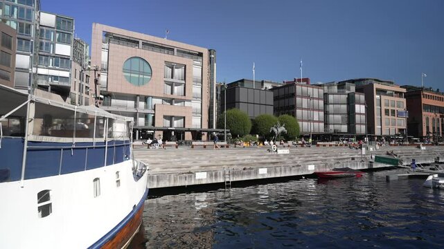 View of different styles of architecture on the waterfront on a sunny morning, Aker Brygge, Oslo, Norway, Scandinavia, Europe