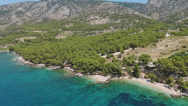 Aerial View of the Paklina Fkk⁩⁦ Beach in Bol on Brac Island, Split Dalmatia, in Croatia. Summer Vacation Resort Near Golden Cape or Golden Horn Zlatni Rat Beach. Famous Adriatic Beach on Adriatic Sea