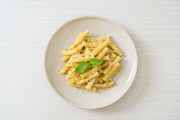 pesto rigatoni pasta with parmesan cheese