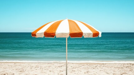 Orange and white striped beach umbrella