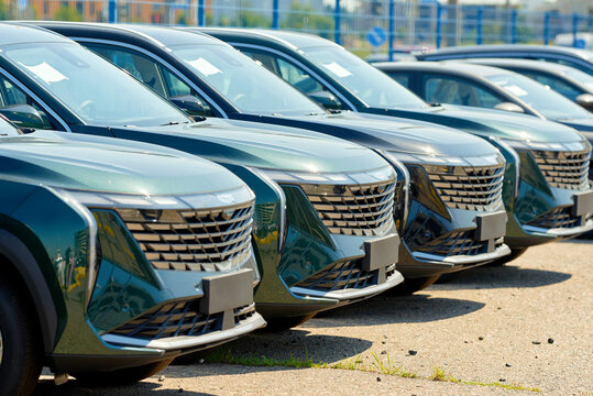 Minsk, Belarus. Jul 16, 2024. Geely Atlas new cars parked in row at dealership parking lot, brand new cars for sale. Chinese crossover, SUV cars. Cars sale stock