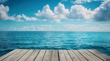 Obraz premium Serene Ocean View from Wooden Pier with Blue Sky and White Clouds - Ideal Summer Vacation Destination