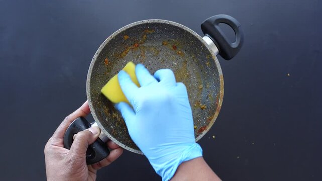 Here are various techniques for effectively cleaning a dirty pan while ensuring safety with gloves