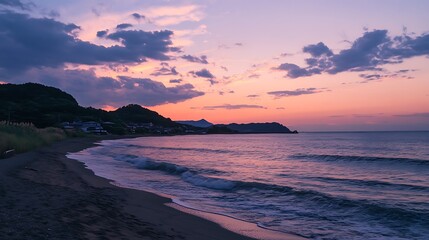 Fototapeta premium Sunset over the Ocean with a Mountain in the Background