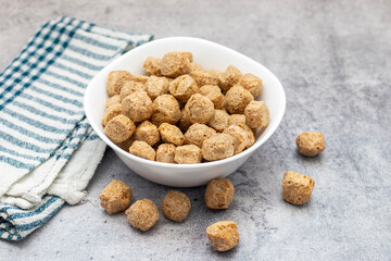 Raw soya chunks are dehydrated, protein-rich, plant-based meat substitutes made from defatted soy flour, commonly used in vegetarian dishes.