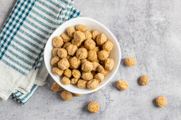 Raw soya chunks are dehydrated, protein-rich, plant-based meat substitutes made from defatted soy flour, commonly used in vegetarian dishes.