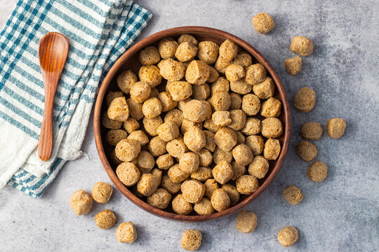 Raw soya chunks are dehydrated, protein-rich, plant-based meat substitutes made from defatted soy flour, commonly used in vegetarian dishes.