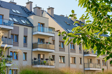 Residential building facade with balconies and windows. Modern city architecture. Apartment building exterior