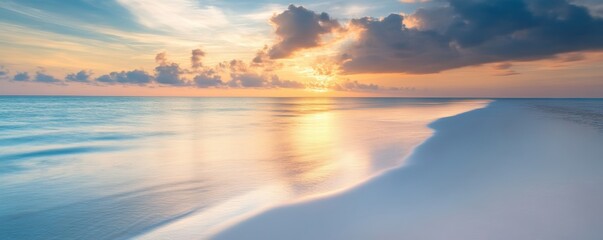 Fototapeta premium Serene beach at sunset with calm waves and clouds, tranquil nature scene. Relaxation and peaceful concept