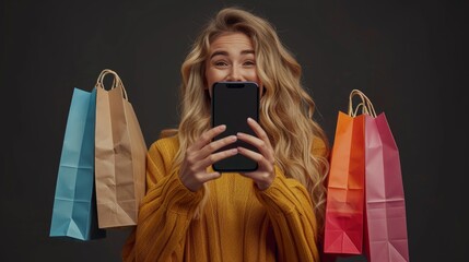 Black Friday shopping online, very happy women for purchases made holding shopper bags, comes out from screen smartphone. Sale deals and e-commerce. Isolated on black background with big cell phone 