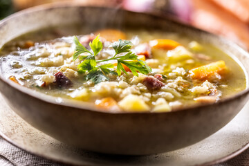 Soup made from barley groats, smoked pork neck, potatoes and root vegetables