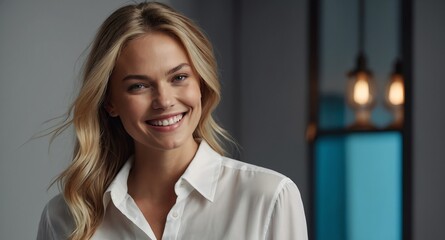 Smiling White female model in white button up blouse on light gray background