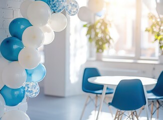 Blue and white minimalist balloon garland in a sunlit room, detailed view.