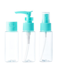 Clear plastic bottles with blue pumps and spray tops arranged on a white background