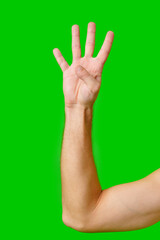 Person Holding Up Four Fingers Against Bright Green Background