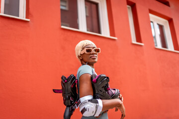 Modern african woman ready to skate in the city