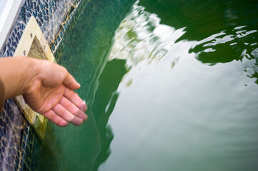 checking pool water temperature