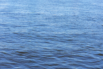 Fototapeta premium The texture of ripples on the water. Natural background.