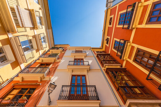 Low angle view of some old residential buildings in the old town of Valencia city, Spain - Powered by Adobe