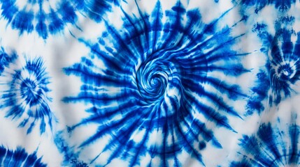 Lively blue swirls interact with white fabric, creating captivating tie-dye designs that inspire psychedelic sensations and bohemian style.