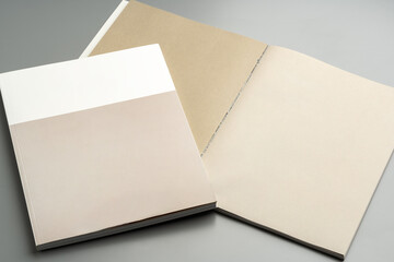 Various color swatches neatly arranged on a gray surface showcasing different shades and finishes in natural light