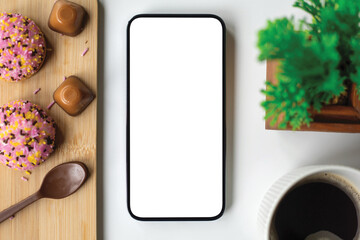 phone with isolated screen background white table sweets in cafe