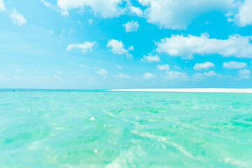 Beautiful tropical beach with turquoise water and white sand on a sunny day in Maldives. summer background and summer vacation concept.