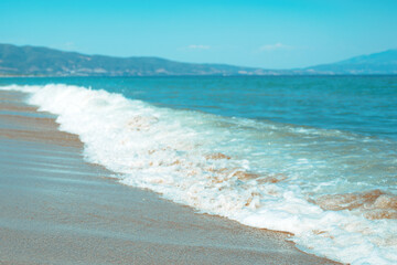 Vrasna beach in summer, Aegean sea waves at the shoreline