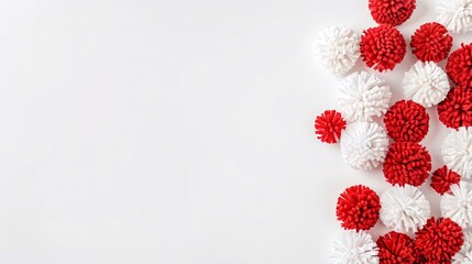 Bright red and white pompoms against a simple, clean background, adding a playful, cheerful touch with plenty of space for Canada Day messages