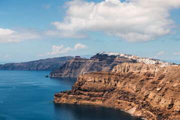 Panoramic view of Santorini island, Greece. Blue sea and the blue sky with white clouds.