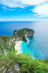 Beautiful stunning view coast side and cliff with natural foam wave of top destination for tourist when go to Bali at Kelingking Beach, Nusa Penida, Bali. © Balnyes Visuals