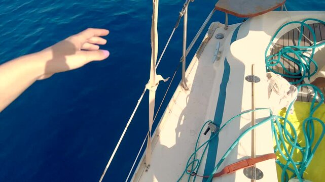 Woman walking Around a Small Boat, Point of View.