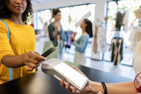 Customer paying through credit card at checkout