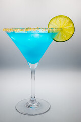 Blue drink in a martini glass
