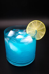 Blue drink in a decorative glass
