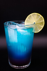 Blue drink in a decorative glass
