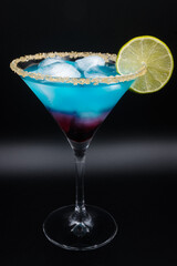 Blue drink in a martini glass
