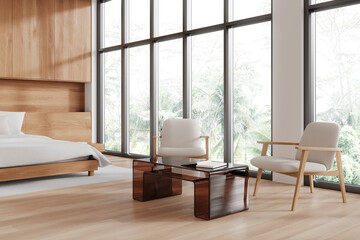 Modern bedroom interior featuring wooden furniture, large windows, and a cozy seating area with two chairs and glass table. Bright and natural background. Concept of contemporary living. 3D Rendering