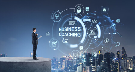 Businessman on stone podium, business coaching and mentoring symbols